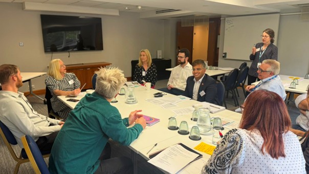 Regional partners reviewing key statistics and local action plans during the workshop break-out sessions.