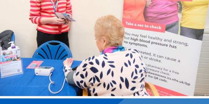 Person having their blood pressure taken